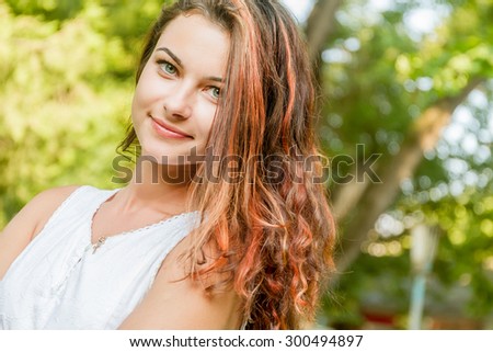 young happy woman on natural green background, smiling happy girl outdoor portrait