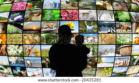 father and son looking at tv screens showing beauty in nature