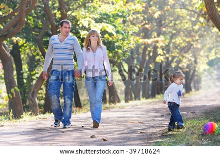 happy family walking in park