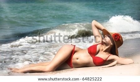 young beautiful girl relaxing on beach