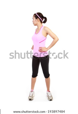 Asian woman stretching ware pink on white isolated.