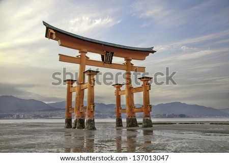 Looming vermilion tori (Shinto gate) Miyajima Island, near Hiroshima, Japan.