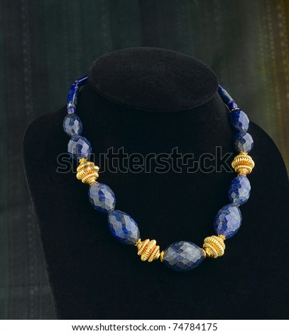 Colorful bead necklace decorated by gold
