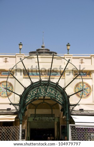 MONTE CARLO, MONACO-MAY 17: The historic canopy and entrance to Cafe de Paris outside the famous Monte Carlo Casino in Monaco draws tourists from around the world on May 17, 2012 in Monte Carlo.