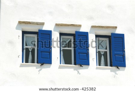 windows on a guest house in typical cycladic architecture in the greek islands