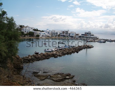 Piso Livadi greek fishing village with a jetty, boats and businesses Paros Cyclades Greek Island Greece