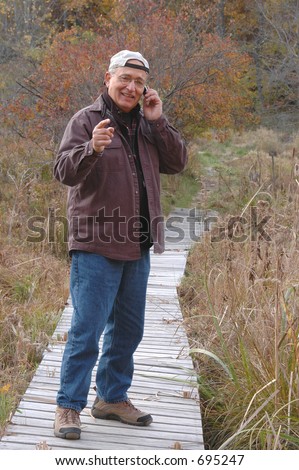 man in wilderness on cell phone 224