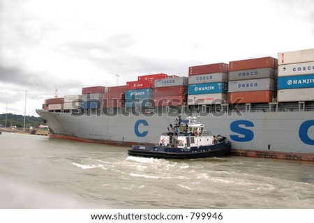 EDITORIAL tug boat guiding container ship