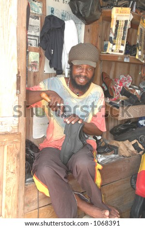 rasta man repairing shoes