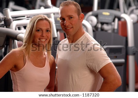 happy fitness couple in the gym