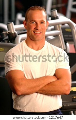 handsome man smiling in fitness center