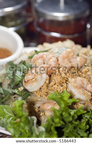 vietnamese food stir fried noodles shredded vegetables, egg crushed peanut Nuoc Cham sauce with shrimp restaurant