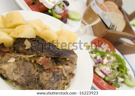 lamb in the paper dinner with greek salad octopus salad house wine greek island taverna restuarant specialty