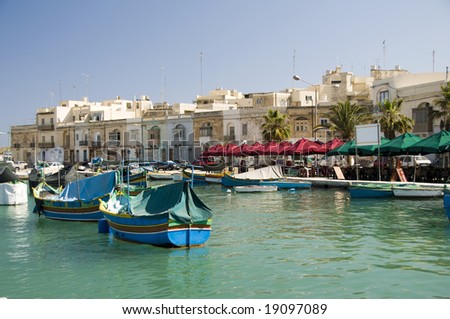 marsaxlokk malta old fishing village with ancient architecture and luzzu classic fishing boats in harbor mediterranean sea