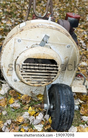 old rusty leaf blower for lawn maintenance in the autumn