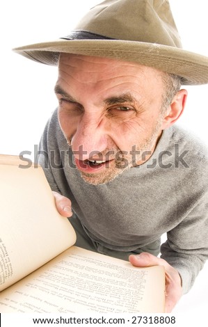 middle age senior man fish eye view expressive face scowling angry mad wearing adventure hat reading book
