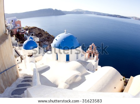 blue dome churches and classic cyclades architecture over the mediterranean sea in oia santorini the famous greek island