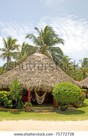 thatch roof cabana hotel resort with hammock Corn Island Nicaragua Central America