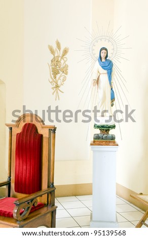 statue and velvet chair inside Cathedral of Granada Nicaragua Central America