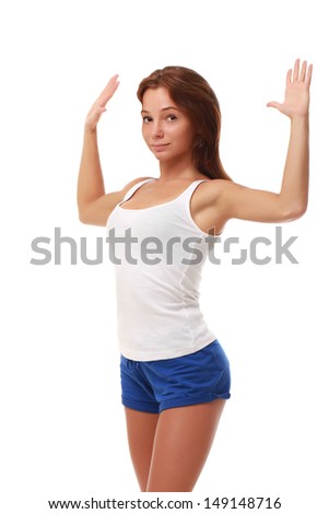 Young attractive female fitness model stretching chest