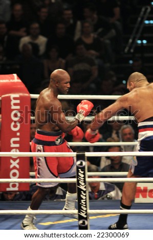 ZURICH - DECEMBER 20, 2008: Evander Holyfield (L) and Nikolai Valuev (R) fight it out during the WBA Heavyweight Championship on December 20, 2008 in Zurich.  Holyfield lost the bout.