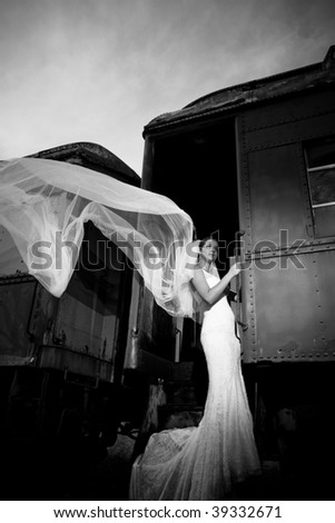 Bride with flying veil on a train