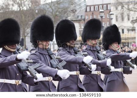 LONDON - APR 13: The colorful changing of the guard ceremony at Buckingham Palace on April 13th, 2013 in London, UK. It is one of England\'s most popular visitor attractions.