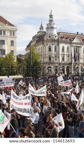 CLUJ - SEPT 15: People join a protest against the Romanian Government that passed a law allowing the gold extraction project at Rosia Montana. On Sept 15, 2013 in Cluj, Romania