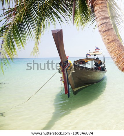 Adaman sea and wooden boat in Thailand. Tourism background with sea beach