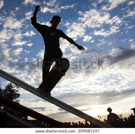 BONTIDA - JUNE 21: Unidentified skateboarder doing a slide trick during the Skateboard Competition at Electric Castle Festival on June 21, 2014 in the Banffy castle in Bontida, Romania