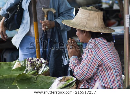 BANGKOK, THAILAND - JANUARY 24: Unknown vendors prepare and sell food on the street on Jan 24, 2014 in Bangkok, Thailand. Government figures indicate more 16,000 registered street vendors in Thailand.