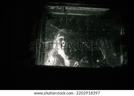 Similar – Image, Stock Photo Woman behind window in building near trees