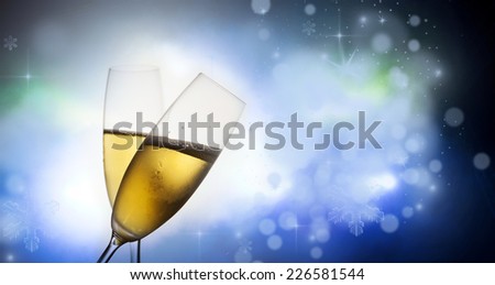 Pair of champagne flutes making a toast