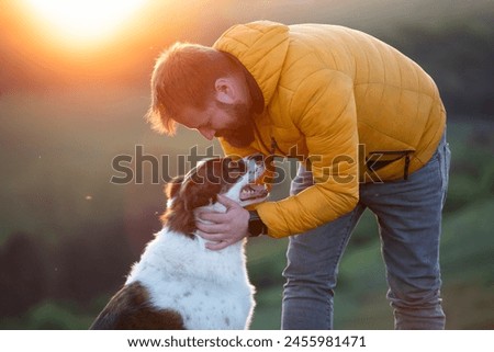 Similar – Image, Stock Photo Hike with dog in the high mountains