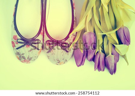 Vintage still life with purple tulips and retro styled shoes
