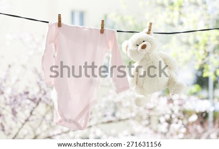 Baby clothes hanging on the clothesline.