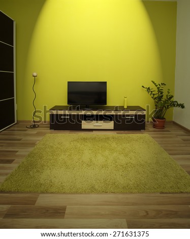 Modern and simple living room interior with spot light on the TV