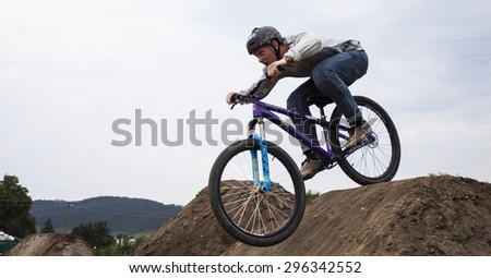 Bontida, Romania - June 27, 2015: Unidentified BMX rider making a bike jump during the BMX Competition, at Electric Castle Festival, Bontida, Romania