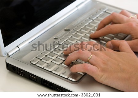 Closeup of a hands typing on the keyboard