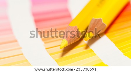 yellow colored pencils and color chart of all colors
