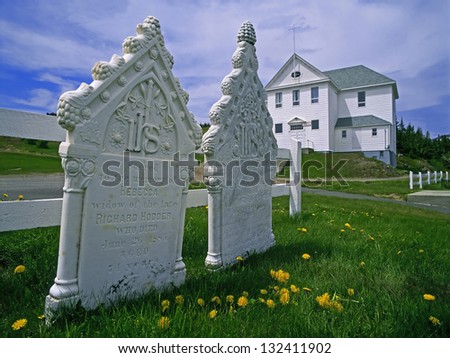 NEW WORLD ISLAND - JUNE 15: Historic artistic tombstones of the first Canada\'s settlers can  be seen in some cemeteries by fishing villages of Twillingate - Durell. Newfoundland, Canada, June 15, 2001