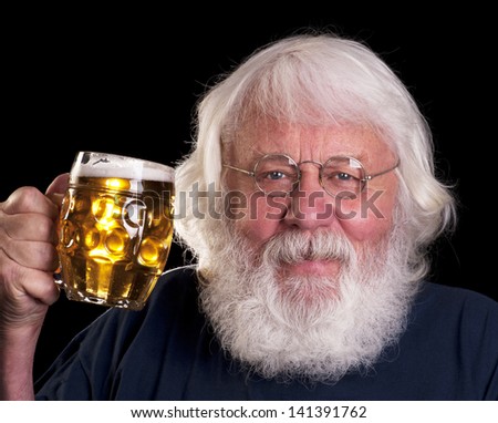 Beer - older bearded man drinking a beer outside the pub