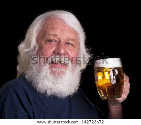 Beer - happy bearded senior drinking a beer outside the pub