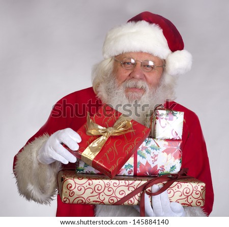 Santa Claus - Christmas figure of Santa Claus with gifts and boxes