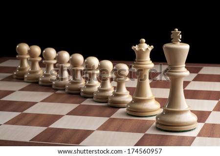 Chess - white king and Queen with eight pawns