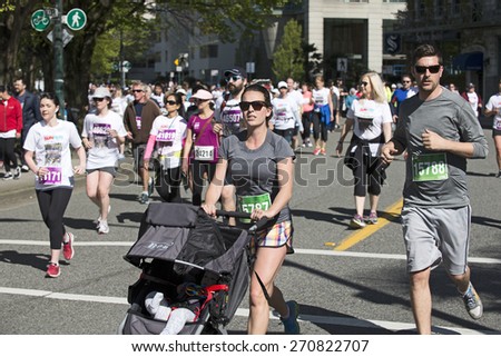 THE VANCOUVER SUN RUN, APRIL 19, 2015: Sponsored by Vancouver Sun newspaper, the 10-kilometer run is one of the largest road races in North America. Event is held yearly in April\'s Sunday since 1985.