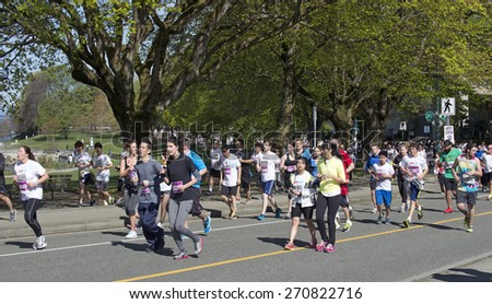 THE VANCOUVER SUN RUN, APRIL 19, 2015: Sponsored by Vancouver Sun newspaper, the 10-kilometer run is one of the largest road races in North America. Event is held yearly in April\'s Sunday since 1985.