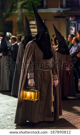 VALLADOLID, SPAIN -Â?Â? APRIL 17, 2014: Nazareno with a lamp in the religious processions during Holy Week on Good Thursday Night, on April 17, 2014 in Valladolid, Spain.