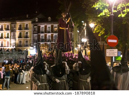 VALLADOLID, SPAIN -Â?Â? APRIL 17, 2014: Nazarenos carrying a Jesuschrist sculpture in the religious processions during Holy Week on Good Thursday Night, on April 17, 2014 in Valladolid, Spain.