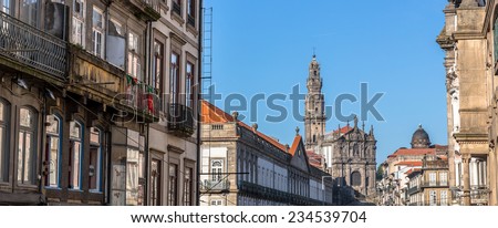 Panoramic of Porto with the Clerigos church and tower at the end of the street.